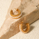 https://www.lifesfuntreasures.ca › products › stainless-steel-pearl-c-hoop-earrings-1717351516

