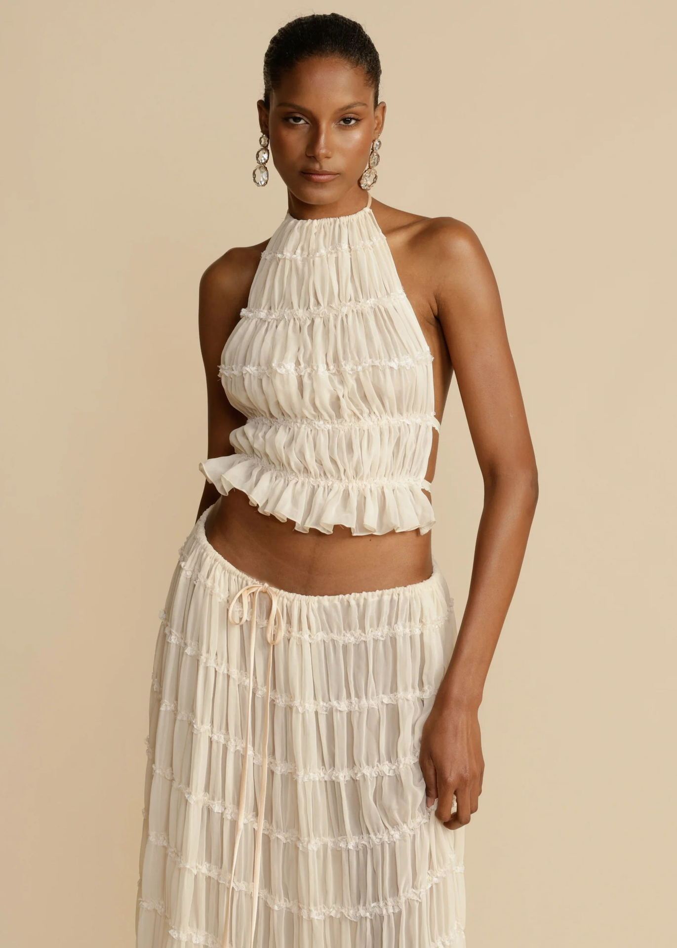 https://www.lifesfuntreasures.ca › products › womens-dress-suit-sexy-sleeveless-backless-cropped-halter-top-and-pleated-long-skirt-beach-clothing

